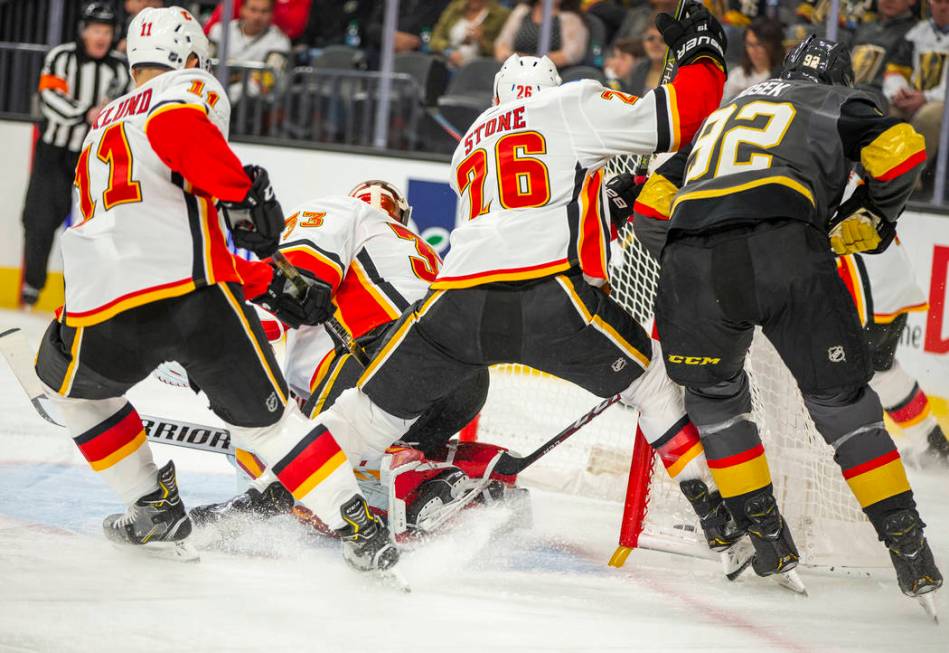 Vegas Golden Knights left wing Tomas Nosek (92) sneaks a goal in behind Calgary Flames goaltend ...