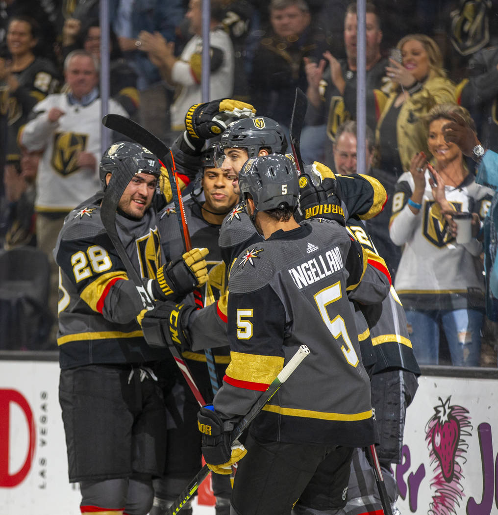 Vegas Golden Knights left wing Tomas Nosek (92, center) is congratulated by teammates after sco ...