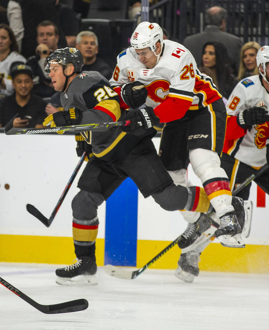 Vegas Golden Knights center Paul Stastny (26) collides with Calgary Flames defenseman Michael S ...