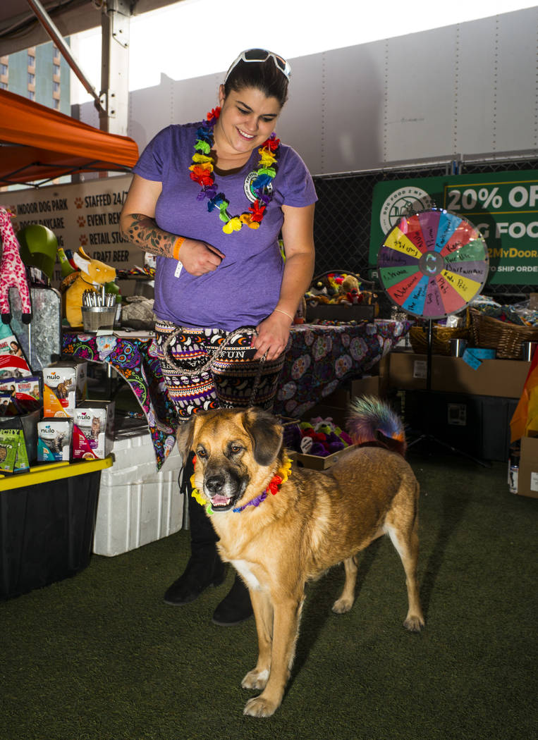 Chloe Kelly, of Dog Food 2 Go, poses with Oakleigh at the Pride Pets area of the Las Vegas Prid ...