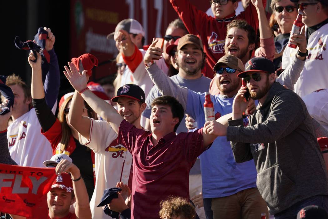 Fans cheer during the fifth inning of Game 2 of the baseball National League Championship Serie ...
