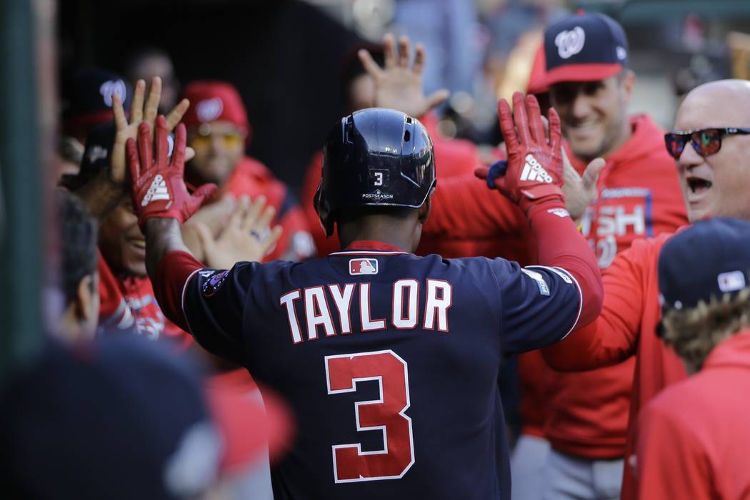 Washington Nationals' Michael A. Taylor is congratulated after hitting a home run during the th ...
