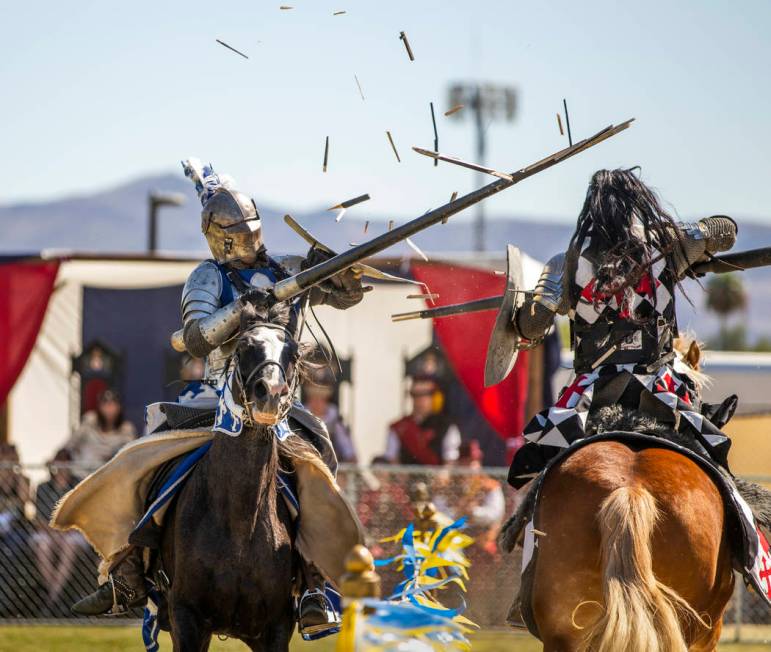 Lances shatter as Sir Jeffrey the Blue Knight, left, and Sir Anthony the Black Knight connect d ...