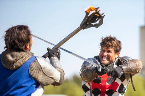 Arms clash as Sir Jeffrey the Blue Knight, left, and Sir Anthony the Black Knight fight to the ...