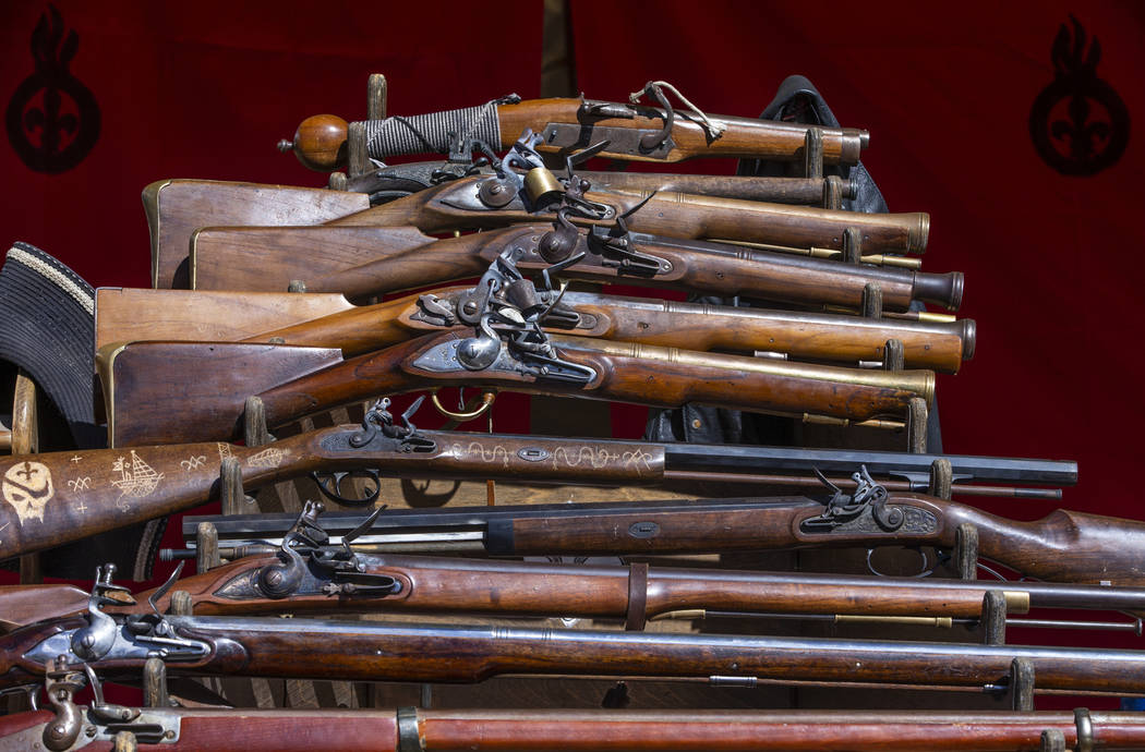 A collection of guns on display during the Age of Chivalry Renaissance Festival at Sunset Park ...
