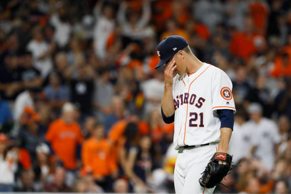 Houston Astros starting pitcher Zack Greinke reacts after giving up a home run to New York Yank ...