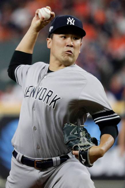 New York Yankees starting pitcher Masahiro Tanaka throws against the Houston Astros during the ...