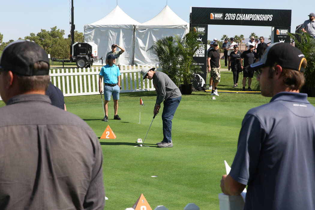 Mike Gonzales of San Diego, Calif., right, competes during the Major Series of Putting at Legac ...