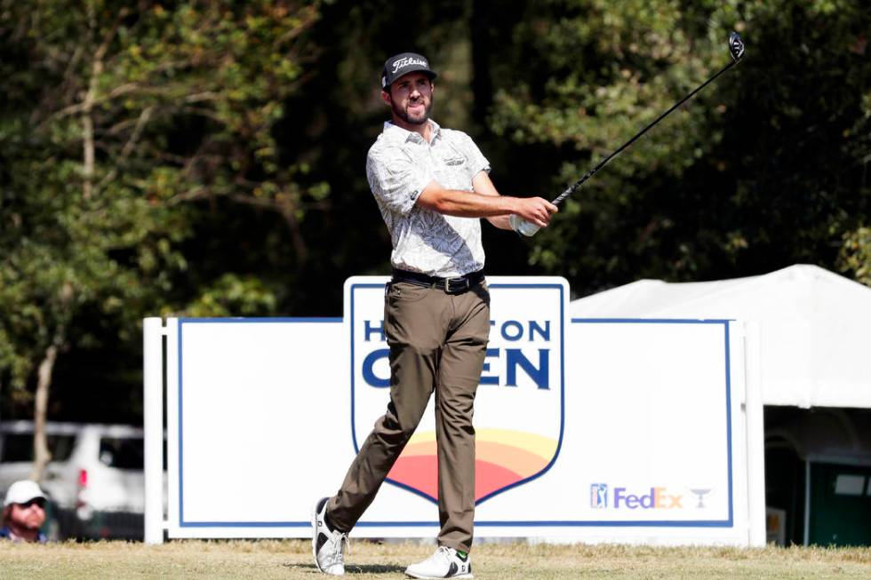 Mark Hubbard watches his tee shot on the second hold during the fourth round of the Houston Ope ...