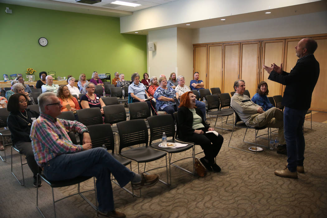 Stuart Holbrook, president of Theriault's, speaks during the Thirty Years a Doll Man event at t ...