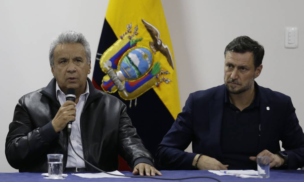Ecuadorian President Lenin Moreno, left, speaks during negotiations with anti-government protes ...