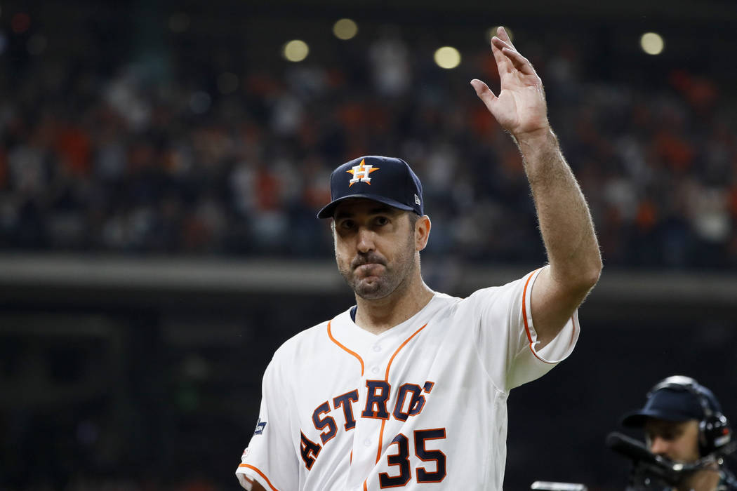Houston Astros starting pitcher Justin Verlander waves after being taken out of the game during ...