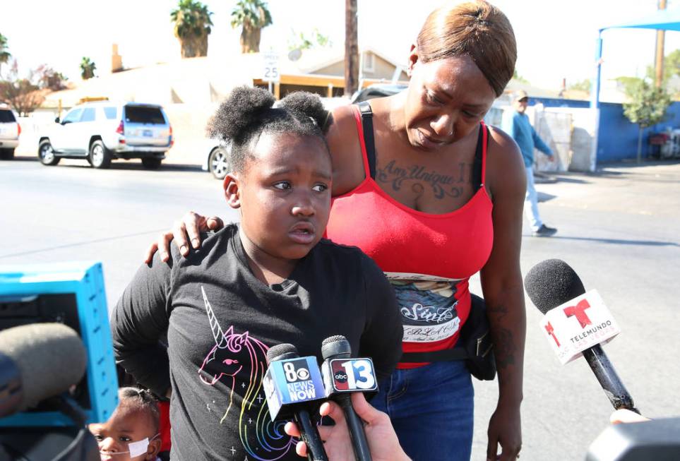 Erika Dillon, right, watches as her daughter Am'Unique Dillon, 8, granddaughter of Jacqueline D ...