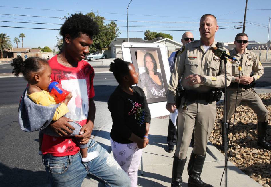 Metropolitan Police Department Lt. Greg Munson, right, speaks about an unsolved fatal hit-and-r ...