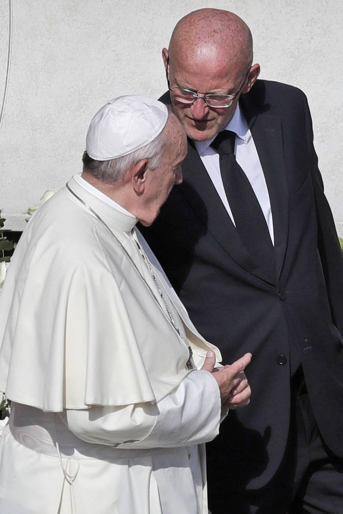 Vatican head of security Domenico Giani, right, shares a word with Pope Francis at the end of a ...