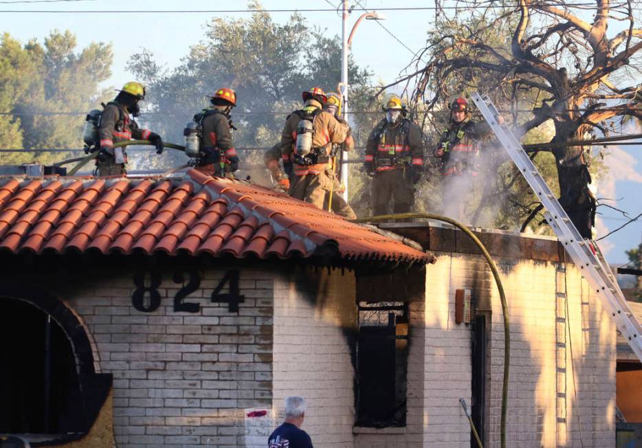 The Clark County and Las Vegas firefighters battle a fire in a commercial area at 824 E. Sahara ...