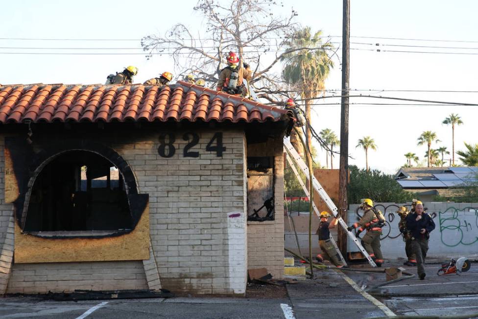 The Clark County and Las Vegas firefighters battle a fire in a commercial area at 824 E. Sahara ...