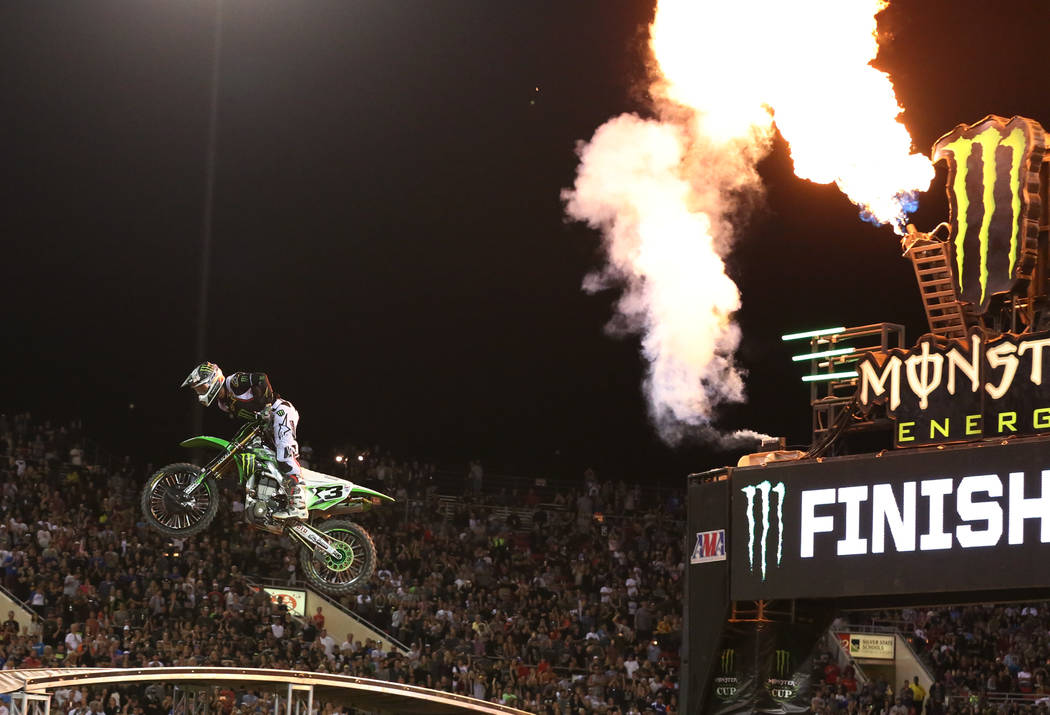 Eli Tomac makes his final jump to win the 2018 Monster Energy Cup Race at Sam Boyd Stadium on S ...