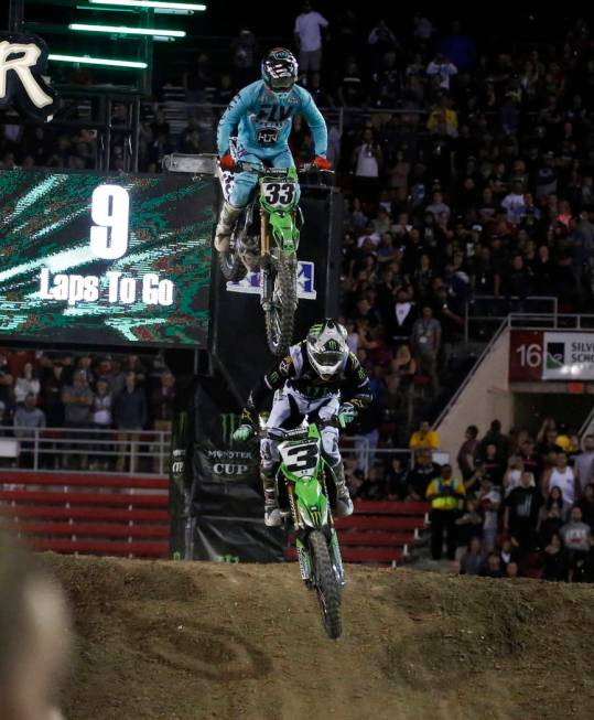 Eli Tomac (3) and Joshua Grant (33) compete during the 2018 Monster Energy Cup Race at Sam Boyd ...