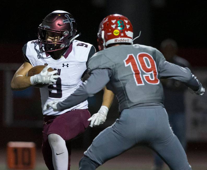 Faith Lutheran junior running back Marcos Canales (9) cuts up field past Arbor View senior defe ...