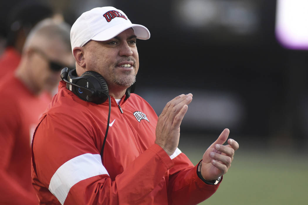 UNLV Head Coach Tony Sanchez encourages his team against Vanderbilt in the second half of an NC ...