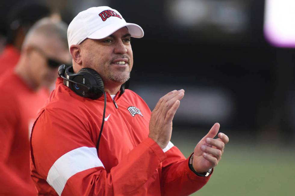 UNLV Head Coach Tony Sanchez encourages his team against Vanderbilt in the second half of an NC ...