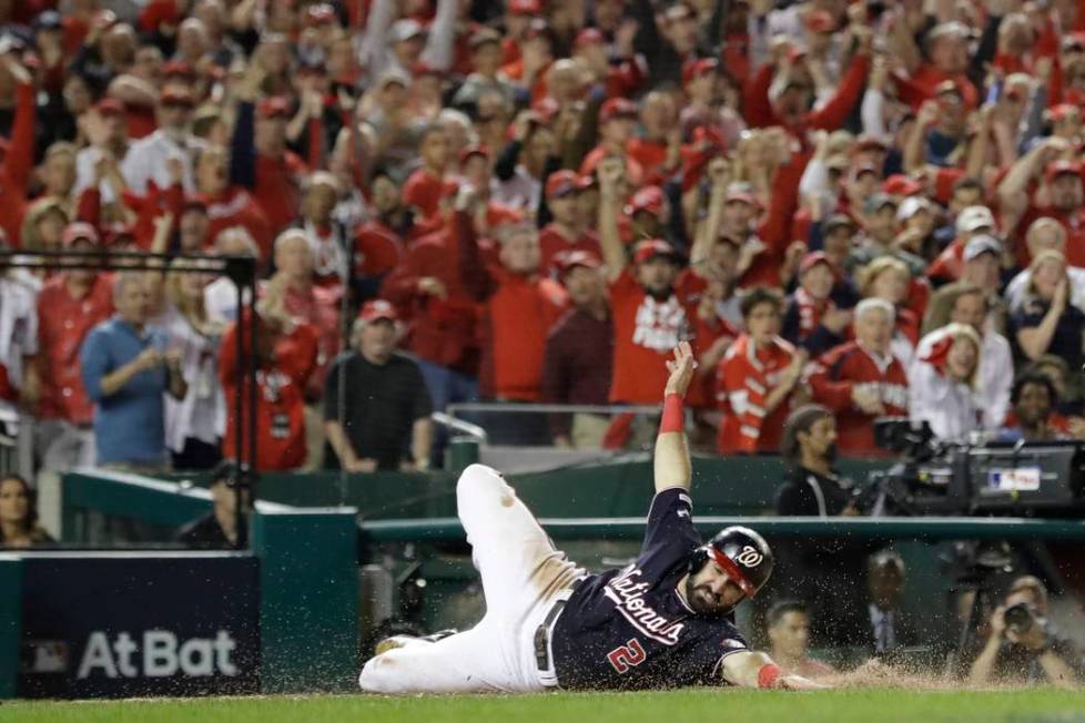 Washington Nationals' Adam Eaton scores on a hit by Anthony Rendon during the third inning of G ...