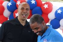 Democratic presidential candidate Sen. Cory Booker, D-N.J., left, shares a laugh after being in ...