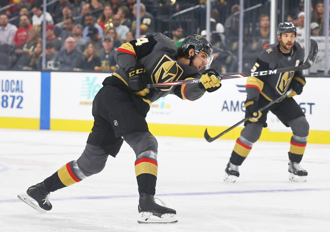 Golden Knights defenseman Nicolas Hague (14) shoots on goal during the first period of Vegas' N ...