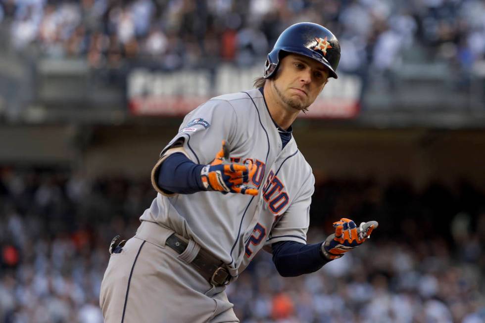 Houston Astros' Josh Reddick (22) reacts after hitting a solo home run against the New York Yan ...