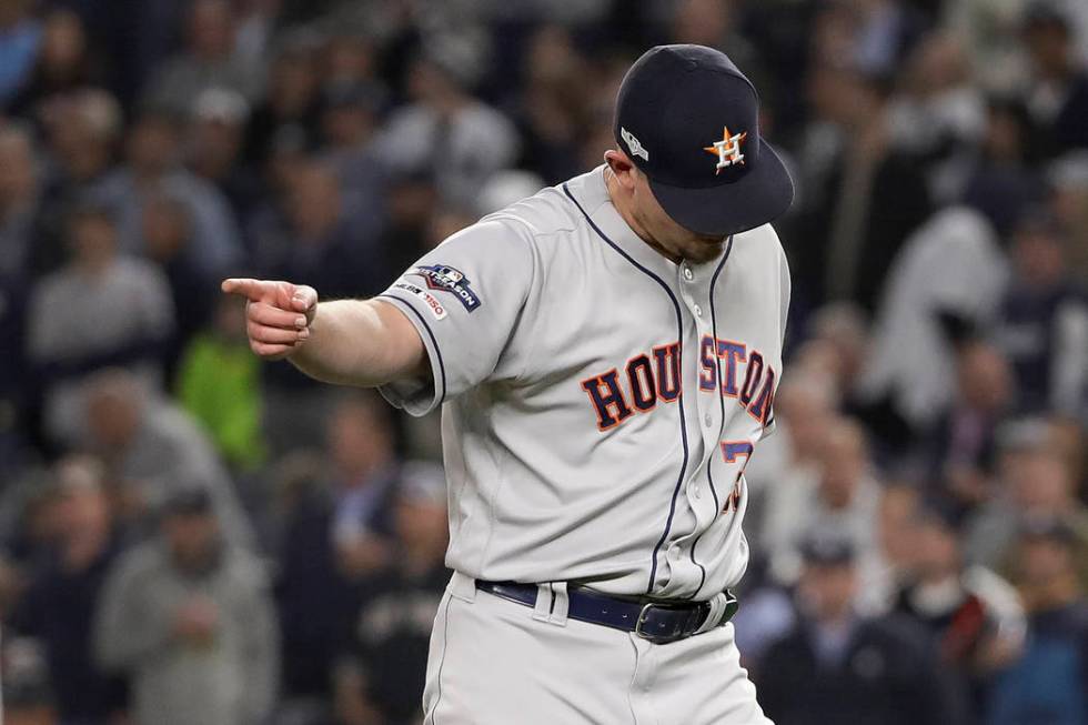 Houston Astros relief pitcher Will Harris (36) motions to teammates at the end of the eighth in ...