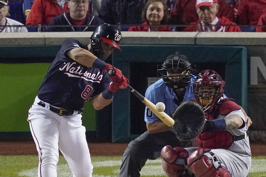 Washington Nationals' Gerardo Parra hits a single during the sixth inning of Game 4 of the base ...