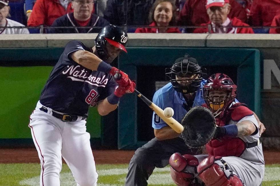 Washington Nationals' Gerardo Parra hits a single during the sixth inning of Game 4 of the base ...