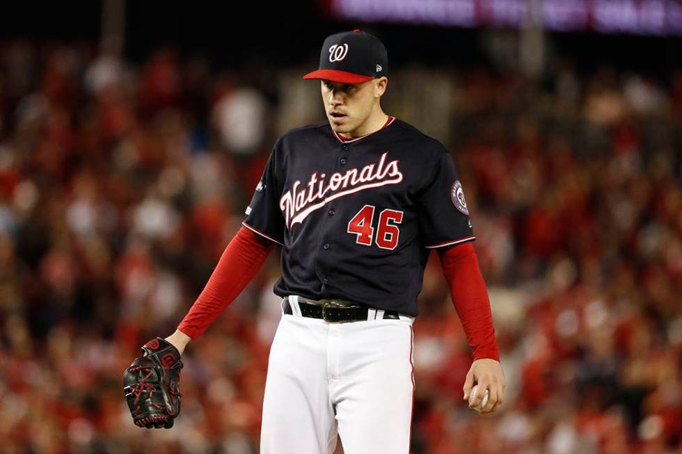 Washington Nationals starting pitcher Patrick Corbin reacts after walking St. Louis Cardinals' ...