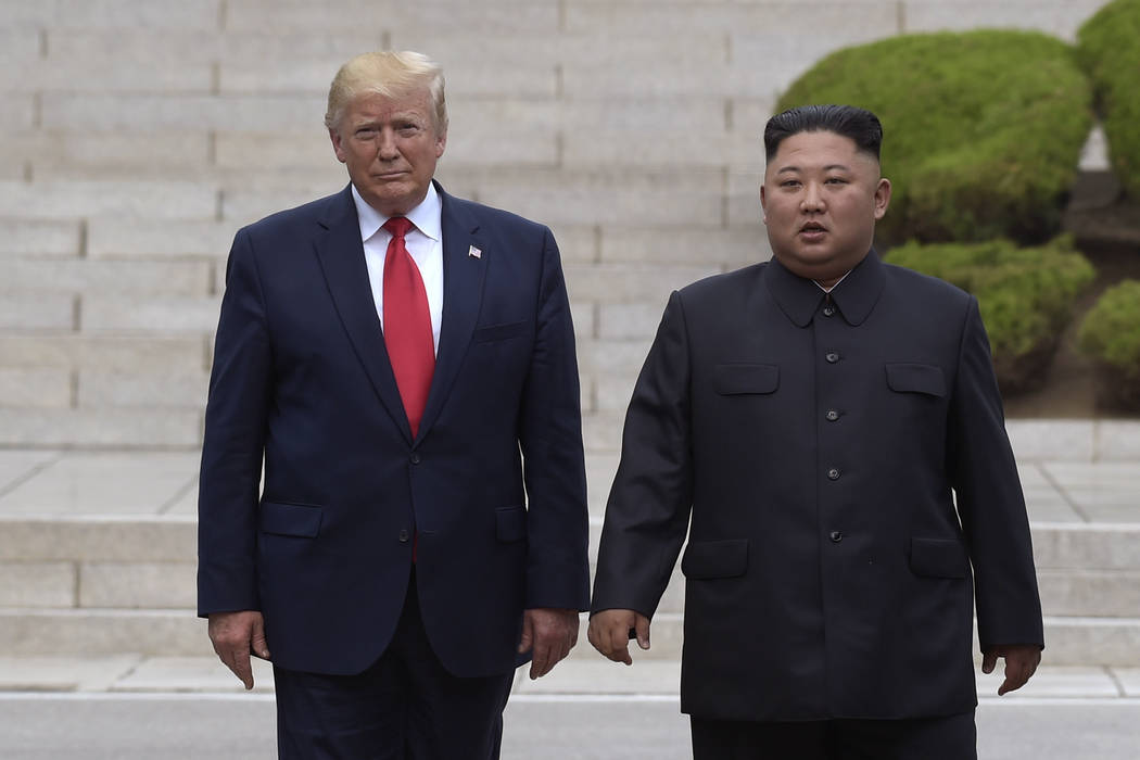 FILE- In this June 30, 2019, file photo, U.S. President Donald Trump, left, meets with North Ko ...