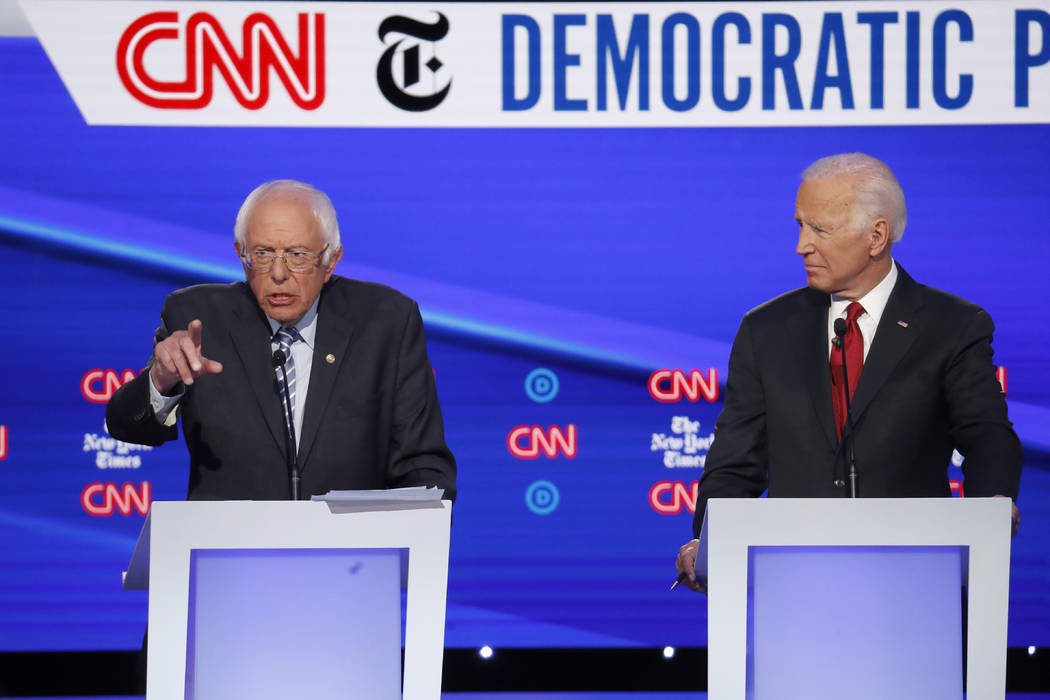 Democratic presidential candidate Sen. Bernie Sanders, I-Vt., left, and former Vice President J ...