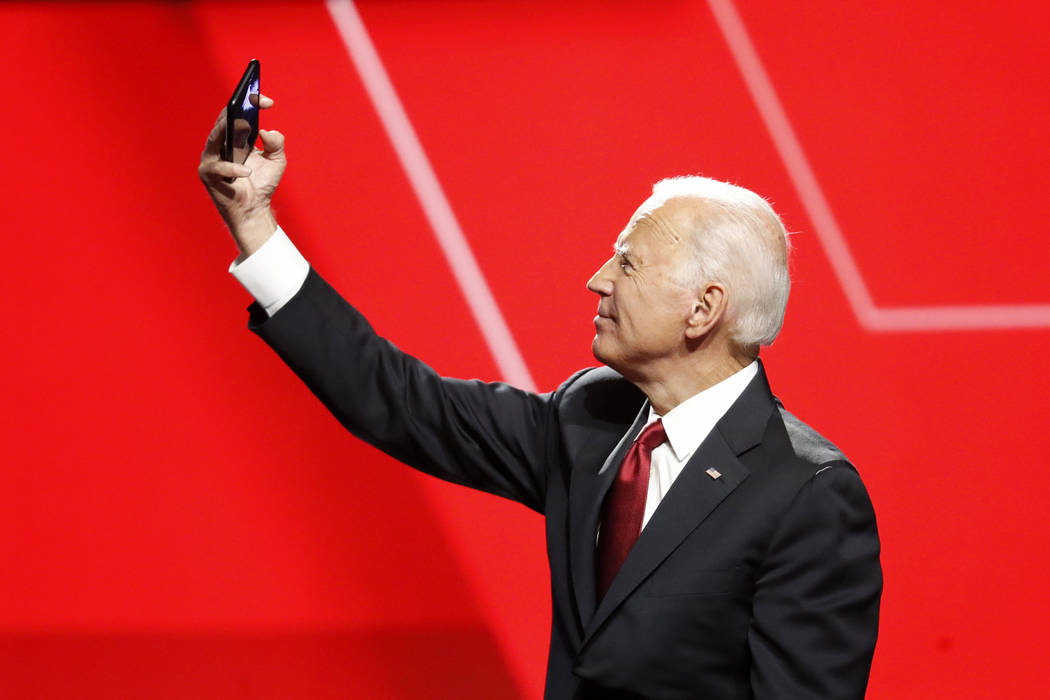 Democratic presidential candidate former Vice President Joe Biden takes a photo following a Dem ...