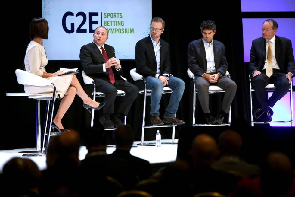 Contessa Brewer of CNBC Business News, interviews, from second from left, NHL commissioner Gary ...