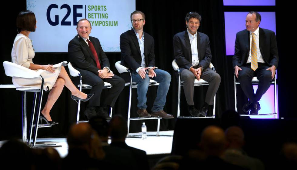 Contessa Brewer of CNBC Business News, interviews, from second from left, NHL commissioner Gary ...