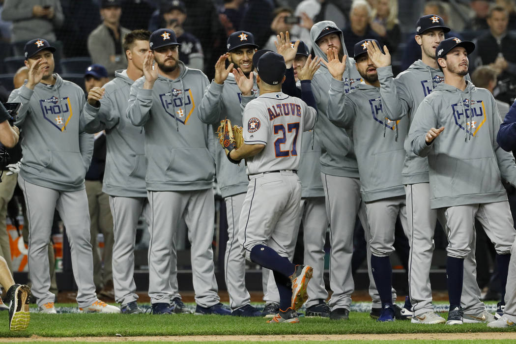 Houston Astros second baseman Jose Altuve celebrates with teammates after their 4-1 win against ...
