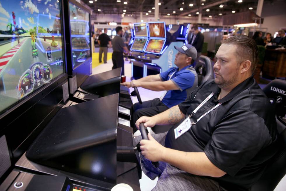 Francis Steele III, right, plays the Lucky Karts game while Francis Steele, both of Oroville, C ...