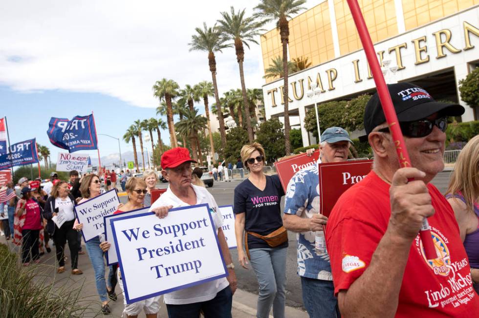 The March for Trump travels past Trump International Hotel on Thursday, Oct. 17, 2019, in Las V ...