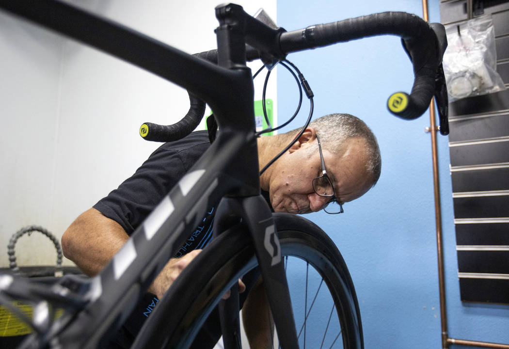 Pro Cyclery employee Shane Broussard fixes a flat tire on a bicycle on Wednesday, Oct. 16, 2019 ...