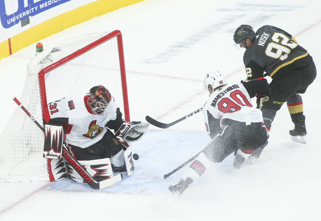Ottawa Senators goaltender Anders Nilsson (31) blocks a shot from Golden Knights' Tomas Nosek ( ...