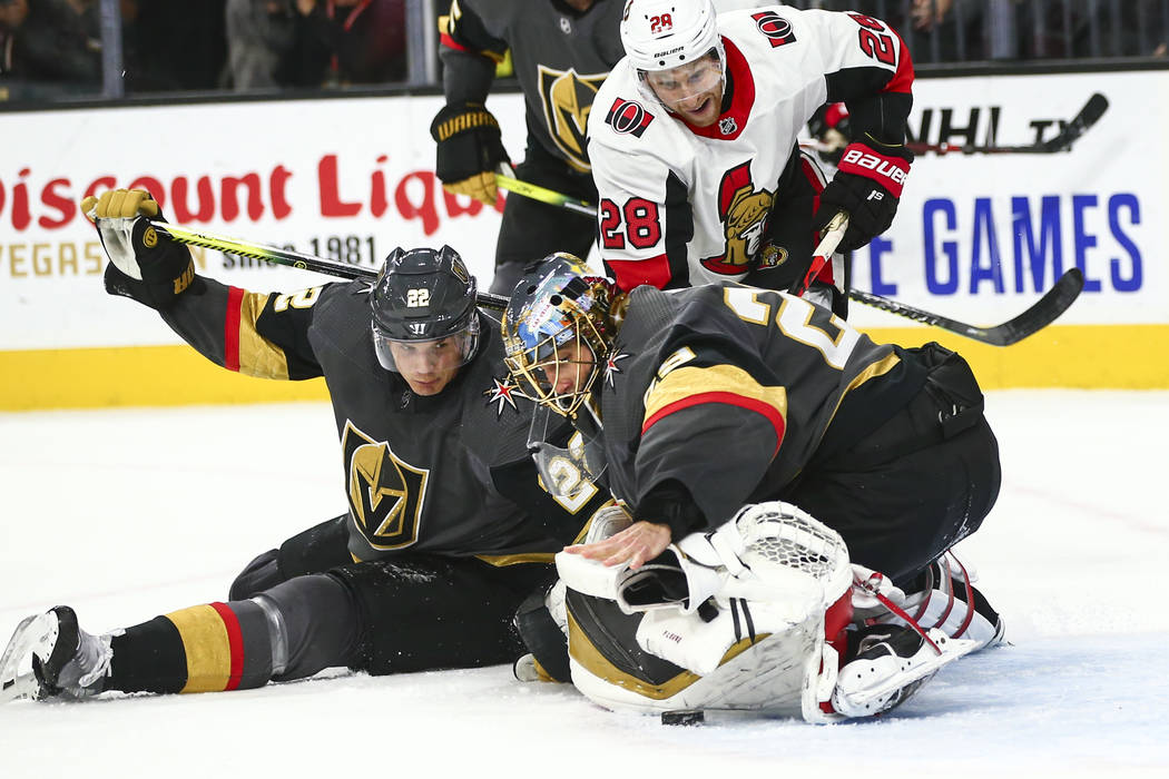 Golden Knights goaltender Marc-Andre Fleury (29) looks to stop the puck with his bare hand afte ...