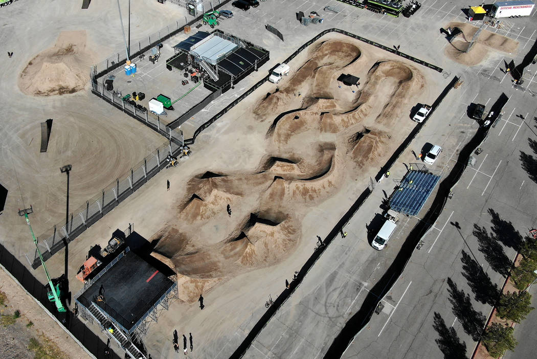 BMX riders take turns on practice runs of the track at Sam Boyd Stadium on Friday, October 18, ...