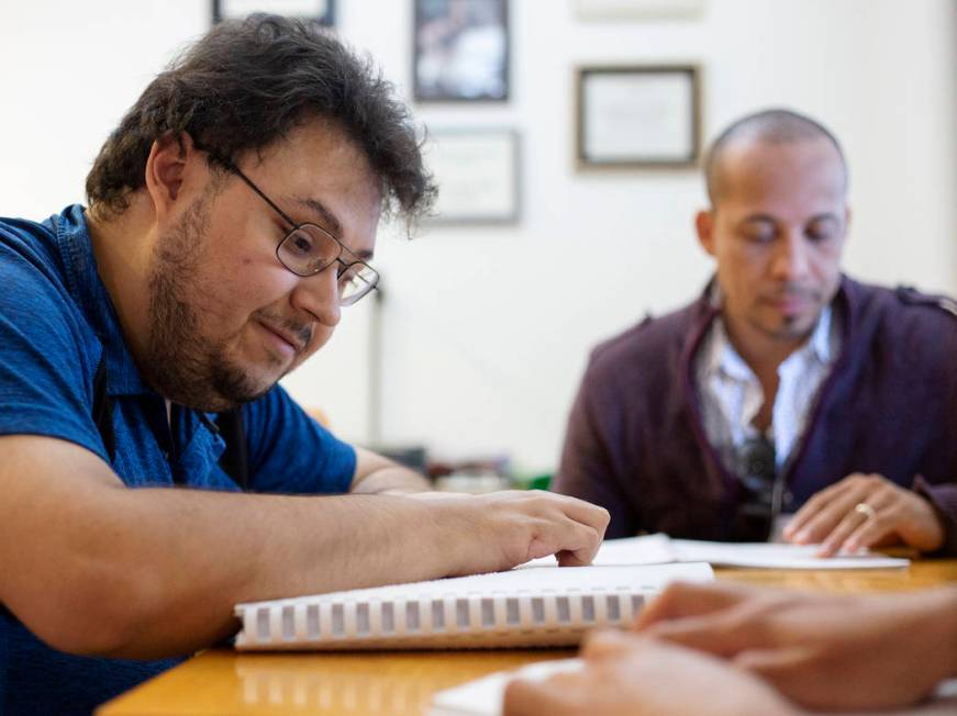 Ivan Medina, left, who is visually impaired due to retina pigmentosa, learns Braille on Friday, ...