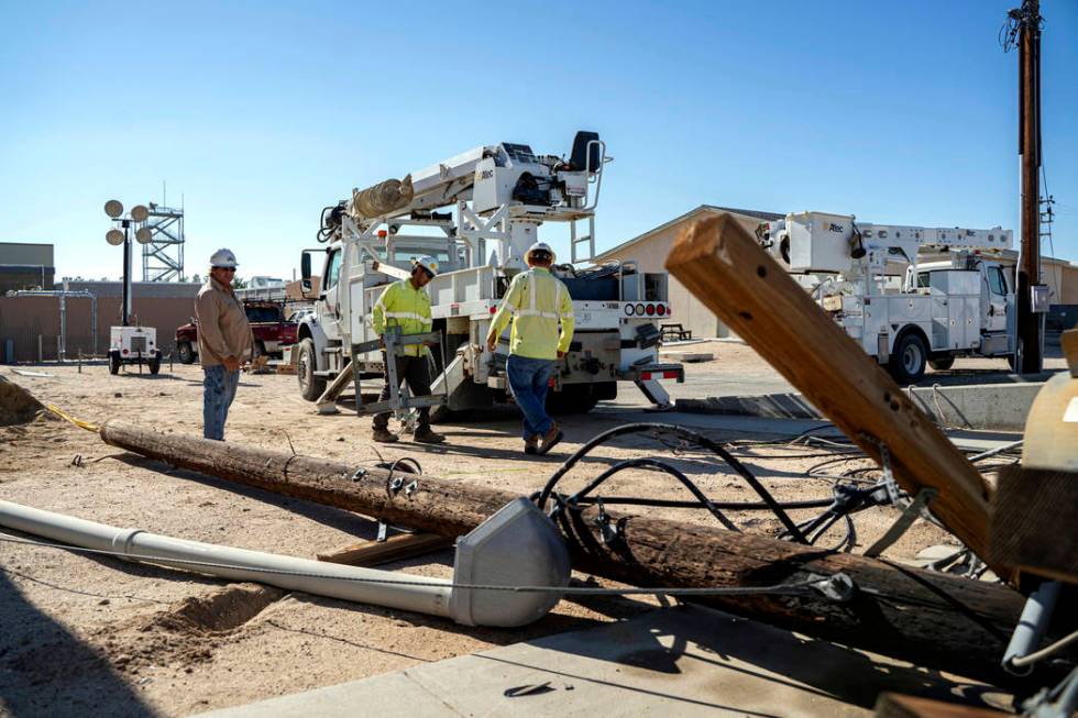 In this July 10, 2019 file photo provided by the U.S. Navy, civilian workers assigned to Naval ...