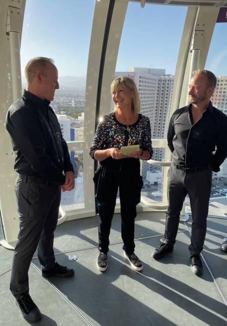 Michael Caprio and Randy Slovacek are shown with Olivia Newton-John at the couple's vow renewal ...