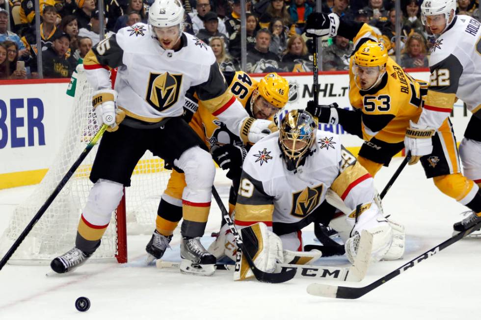 Vegas Golden Knights goaltender Marc-Andre Fleury (29), Jon Merrill (15) and Nick Holden (22) s ...